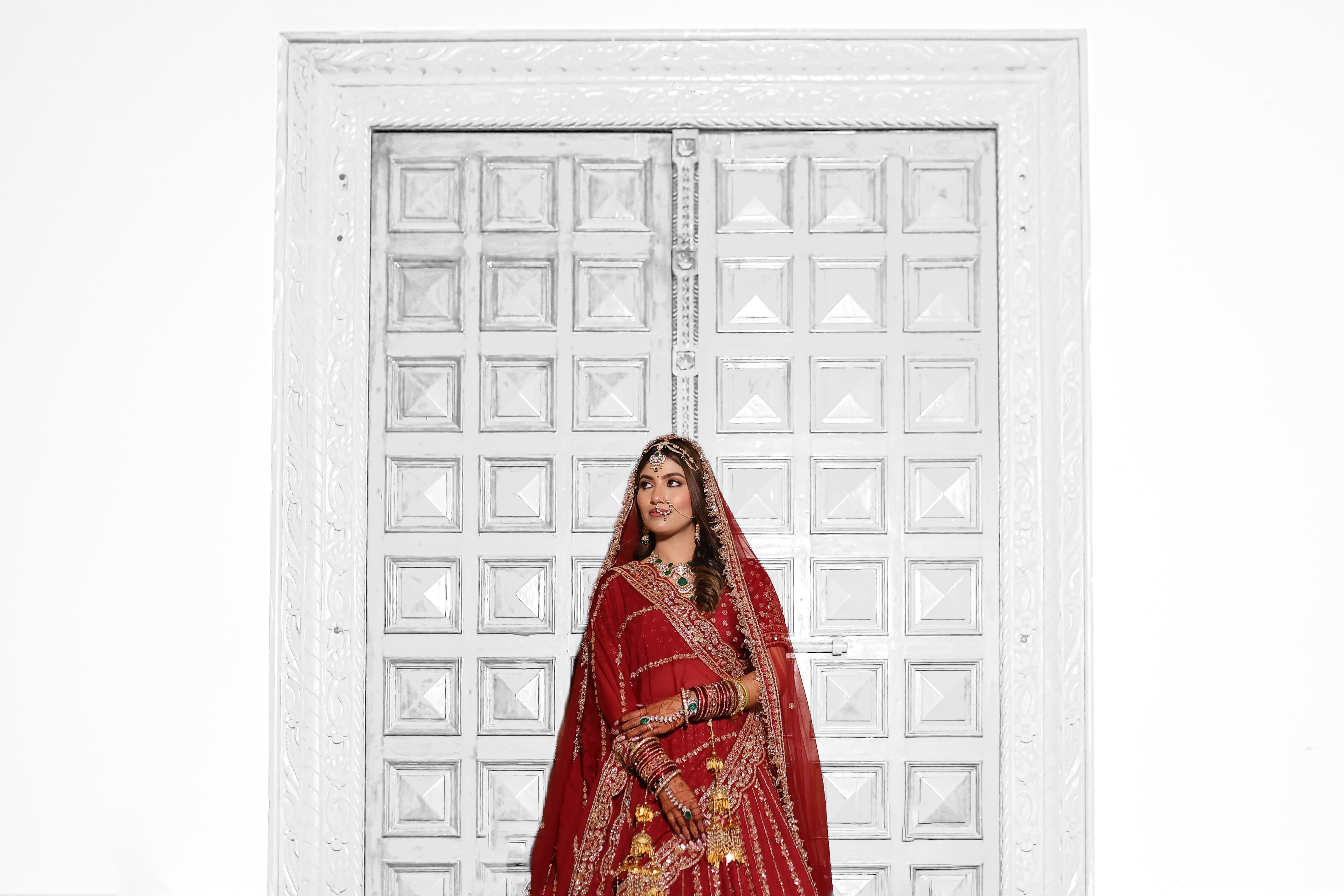 A bride in a red bridal lehenga